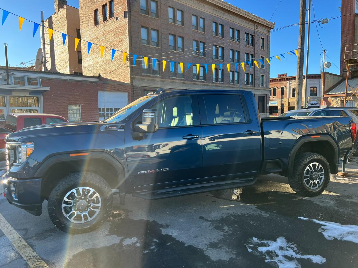 2022 Blue /Charcoal GMC Sierra 2500HD AT4 Crew Cab 4WD (1GT49PE70NF) with an 6.6L Gas engine, automatic transmission, located at 116 5th Avenue South, Lewistown, MT, 59457, 47.063877, -109.427879 - Photo#1